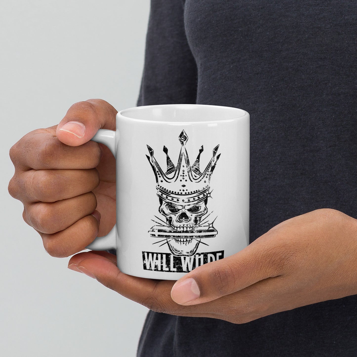 White glossy mug with the Will Wilde Skull Harmonica Logo